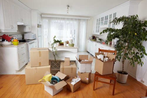 Removal team loading boxes and furniture for transport in Sutton