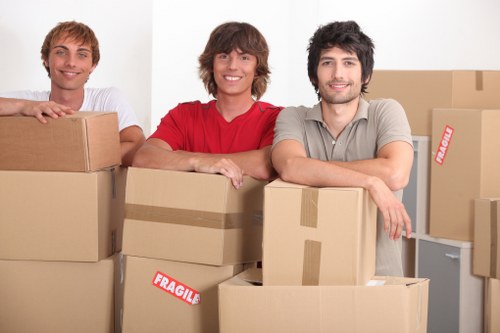 Packed boxes and moving equipment ready for a Sutton removals job