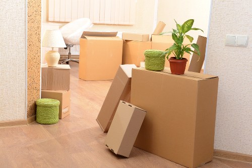 Packed office equipment and furniture prepared for removal