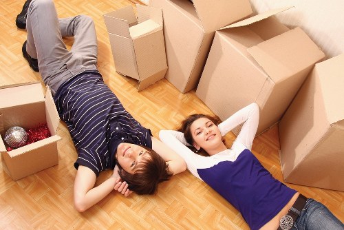 Commercial movers loading office furniture at a Sutton business premises