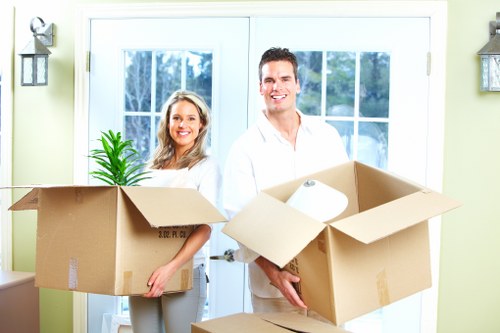 Boxes and furniture loaded into a van for urgent relocation